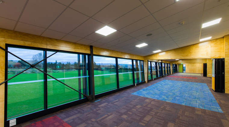 The new ACG Gymnasium offers plenty of natural architecture, ceiling, daylighting, floor, flooring, interior design, leisure centre, real estate, sport venue, structure, wall, brown