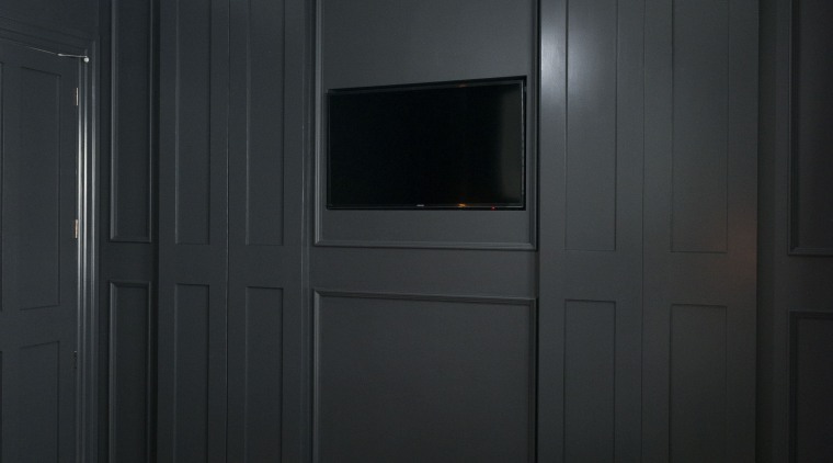Open sesame dark grey wall panelling disguises the ceiling, door, furniture, interior design, wall, wardrobe, black