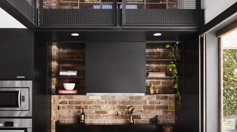 On this project by Maytree Studios, the recycled countertop, interior design, kitchen, black