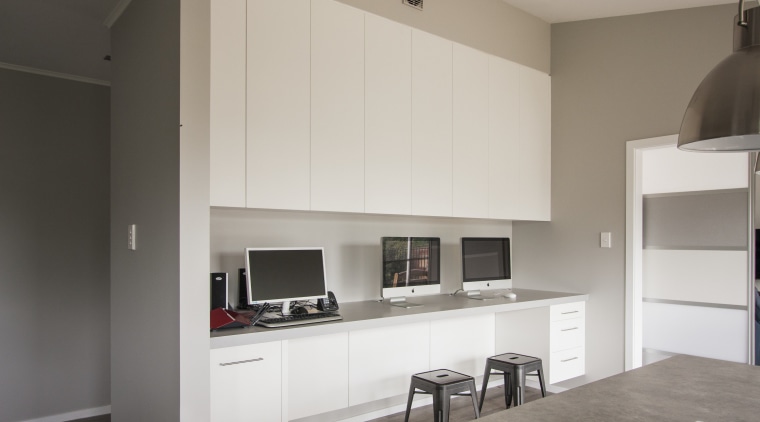 One wall of this kitchen is taken up architecture, cabinetry, interior design, kitchen, real estate, room, gray