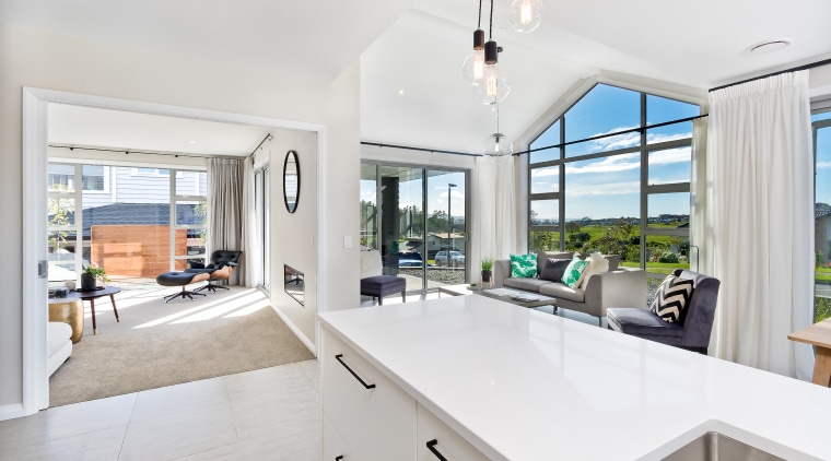 Features of this Sentinel Homes showhome include two architecture, estate, home, house, interior design, property, real estate, window, white