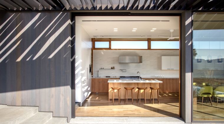 Two large glass doors pocket back into the architecture, house, interior design, white
