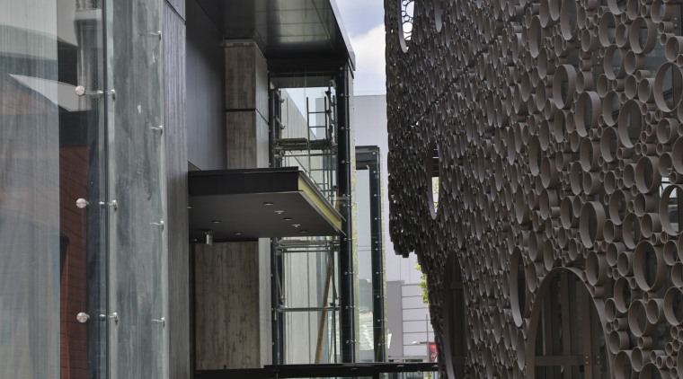 First floor shops and walkways offer glimpses into architecture, building, black, gray