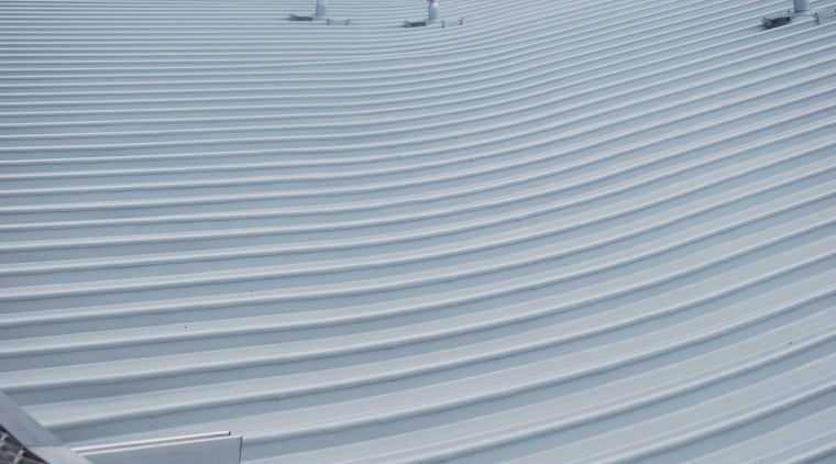 The Manakau Bus Interchanges saw-tooth roof features roofing roof, sky, gray