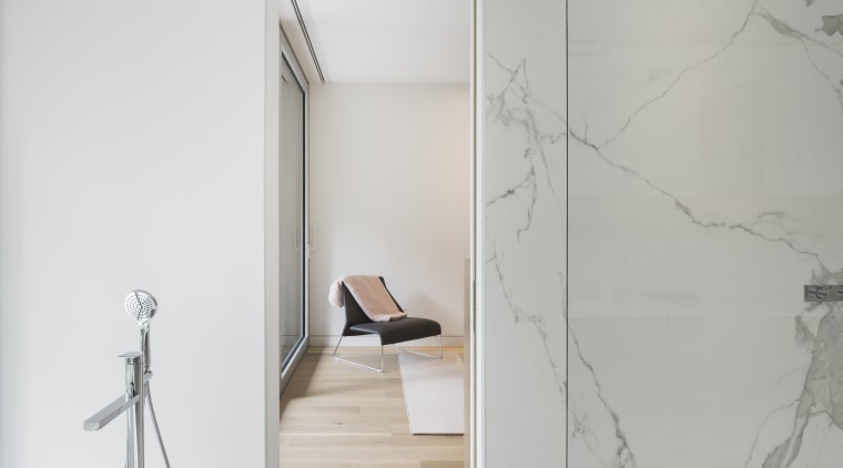 This vacation home has long slender plan, with floor, glass, interior design, product design, tap, wall, gray, white