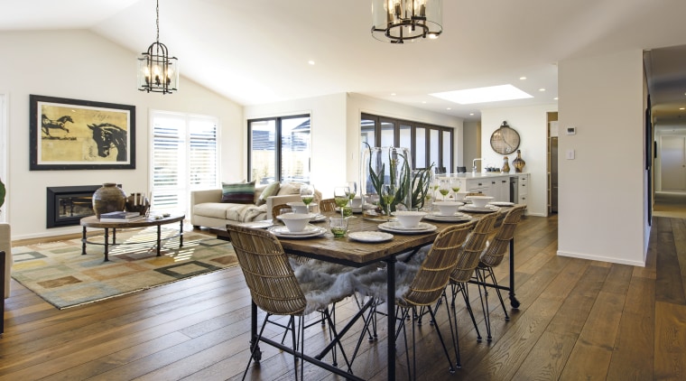 On the interior of this GJ Gardner showhome, dining room, estate, floor, flooring, hardwood, home, interior design, living room, property, real estate, room, table, white