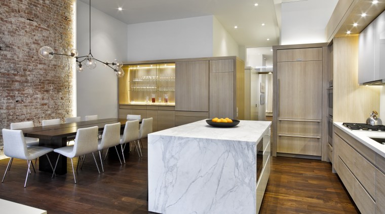The kitchen sits off to one side of ceiling, countertop, floor, flooring, interior design, kitchen, wood flooring, gray