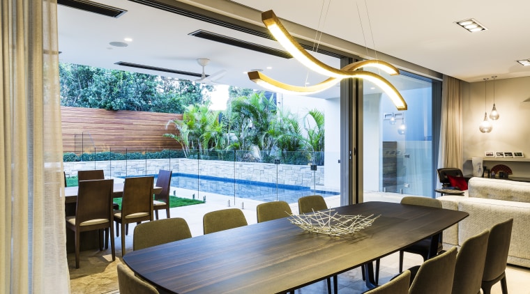 Connected to the combined living, kitchen, dining space ceiling, dining room, interior design, real estate, table, window, white