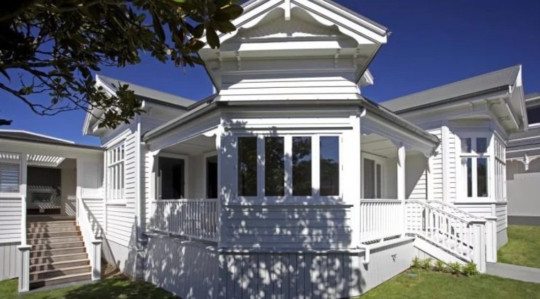 This transitional villa restoration by Scarlet Architects features architecture, building, cottage, elevation, estate, facade, historic house, home, house, property, real estate, residential area, siding, window, gray