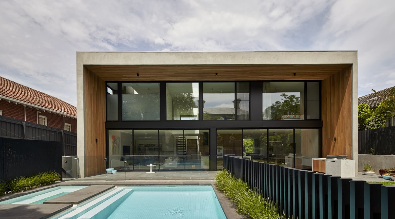 Contemporary suburban family home with concrete,… | Trends