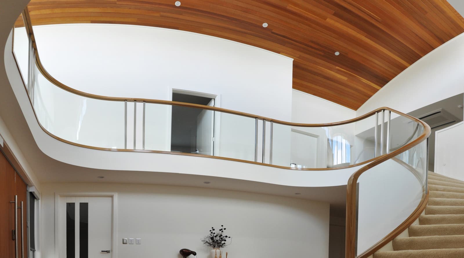 Curved glass balustrade with wood frame by… | Trends
