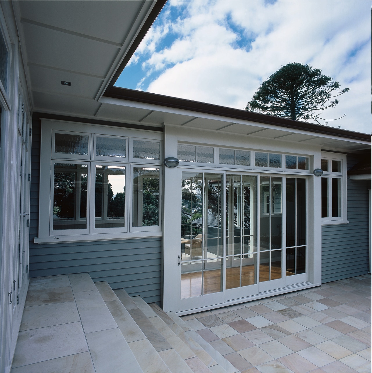 Courtyard area of house with glass sliding doors, daylighting, door, facade, home, house, orangery, porch, property, real estate, residential area, siding, window, gray, black