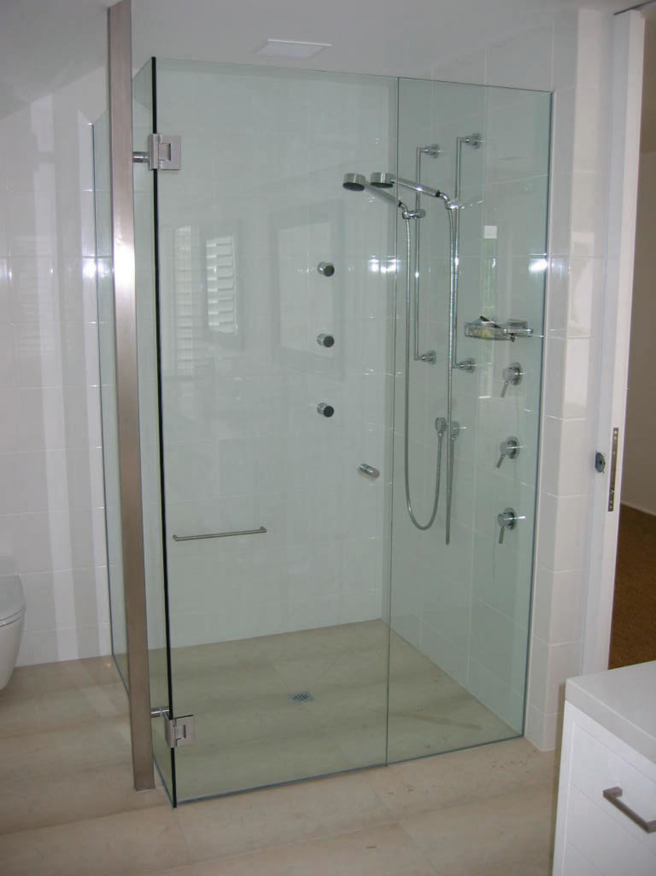 The view of a shower bathroom, glass, plumbing fixture, shower, shower door, gray