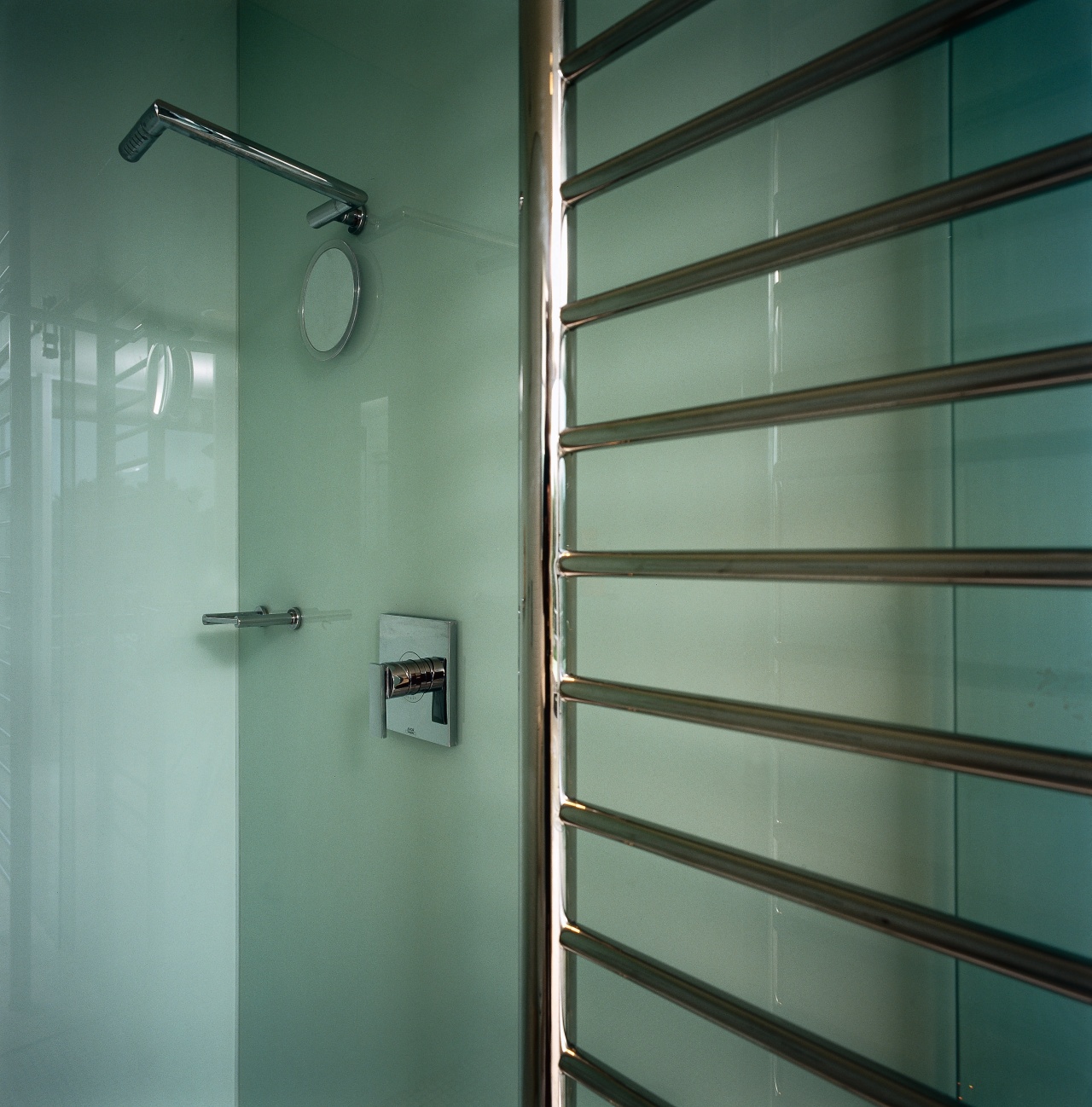 The detail of a heated towel rail bathroom, daylighting, glass, interior design, lighting, plumbing fixture, wall, green, teal