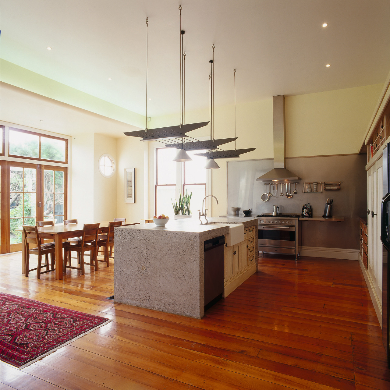 The view of a renovated kitchen ceiling, countertop, floor, flooring, hardwood, home, interior design, kitchen, laminate flooring, living room, property, real estate, room, wall, wood, wood flooring, brown, gray