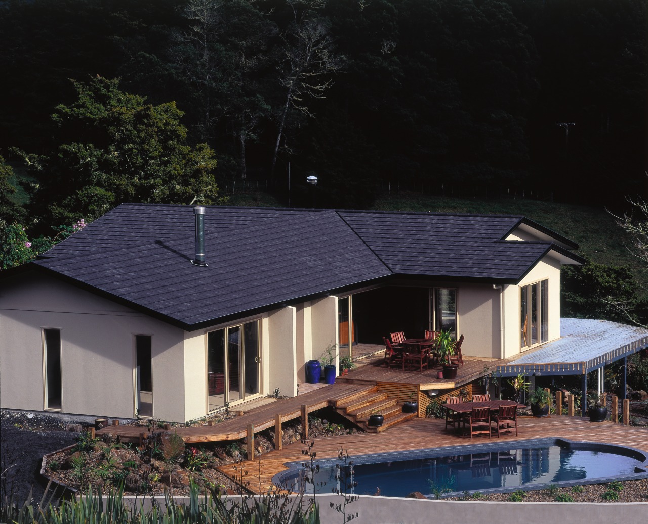 Contemporary country home with extensive decking, pool, cream cottage, estate, home, house, outdoor structure, property, real estate, residential area, roof, siding, black