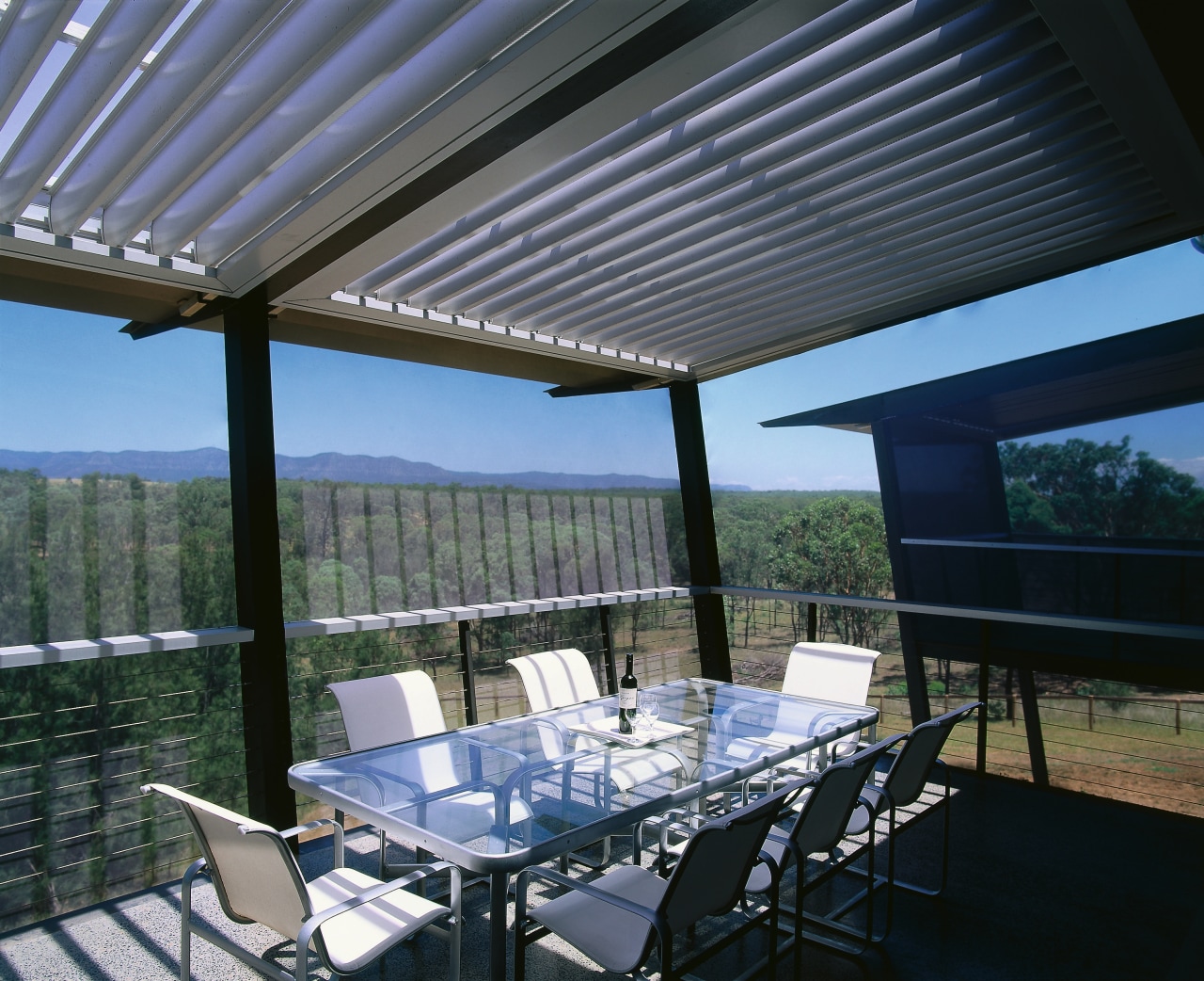 View of the balcony with dining area daylighting, lighting, outdoor structure, patio, real estate, roof, shade, black, gray