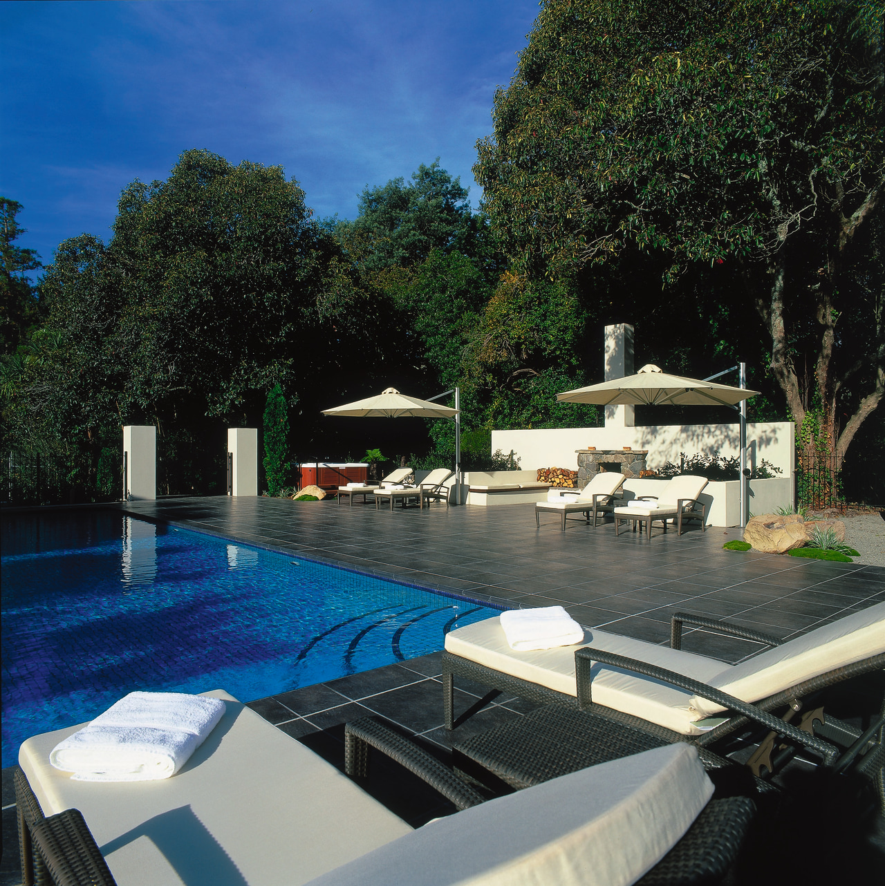 View of the poolside estate, leisure, real estate, reflection, resort, sky, swimming pool, tree, villa, water, waterway, black