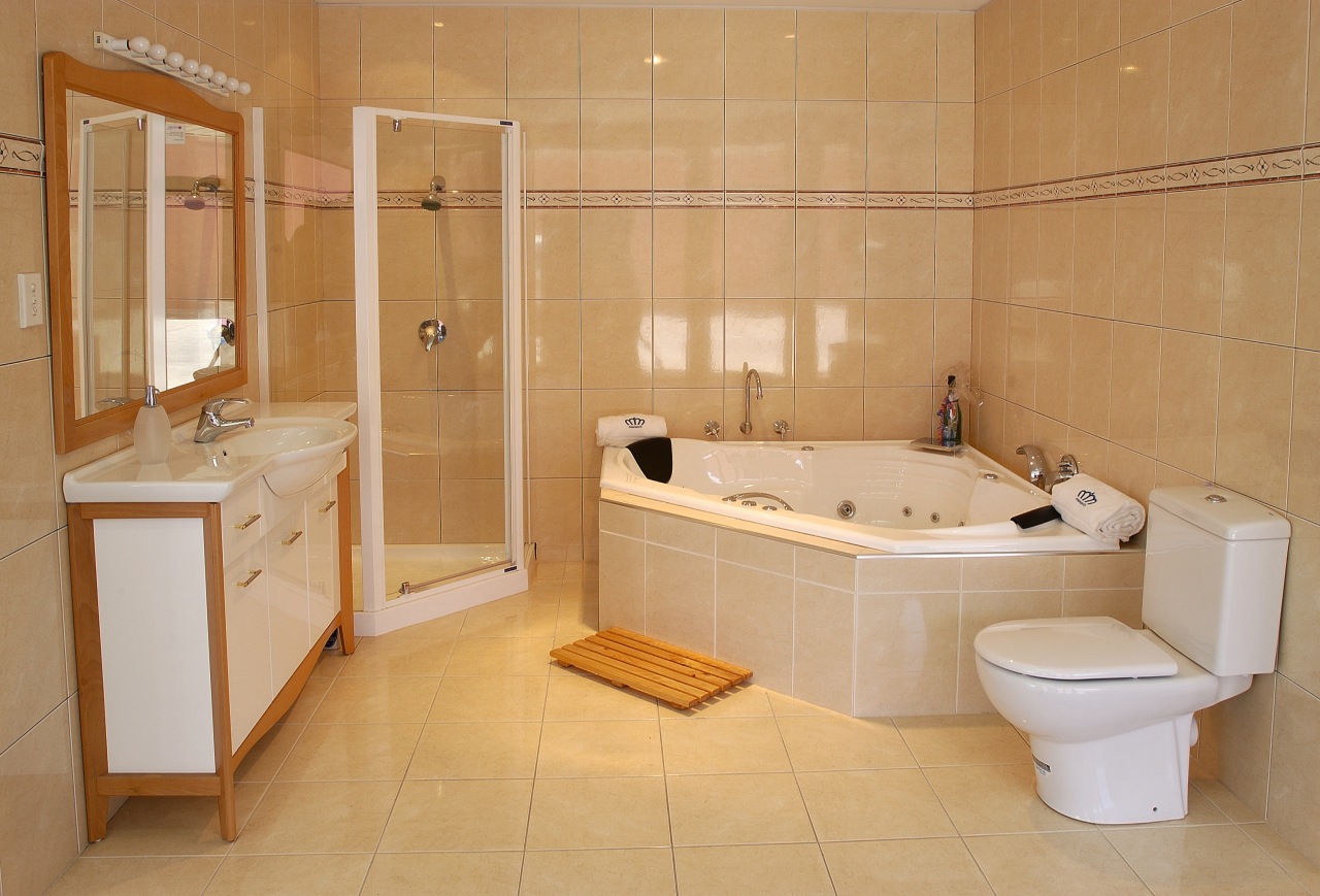 Bathroom with natural coloured wall and floor tiles, bathroom, bathtub, floor, flooring, property, room, tile, orange