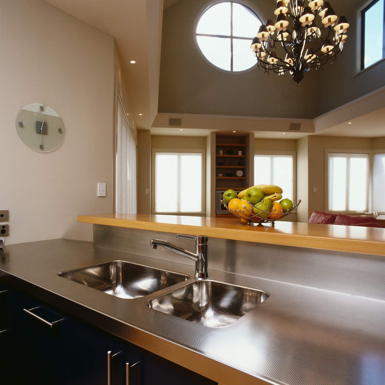 Kitchen with dark blue cabinetry, stainless steel benchtop ceiling, countertop, cuisine classique, interior design, kitchen, under cabinet lighting, brown