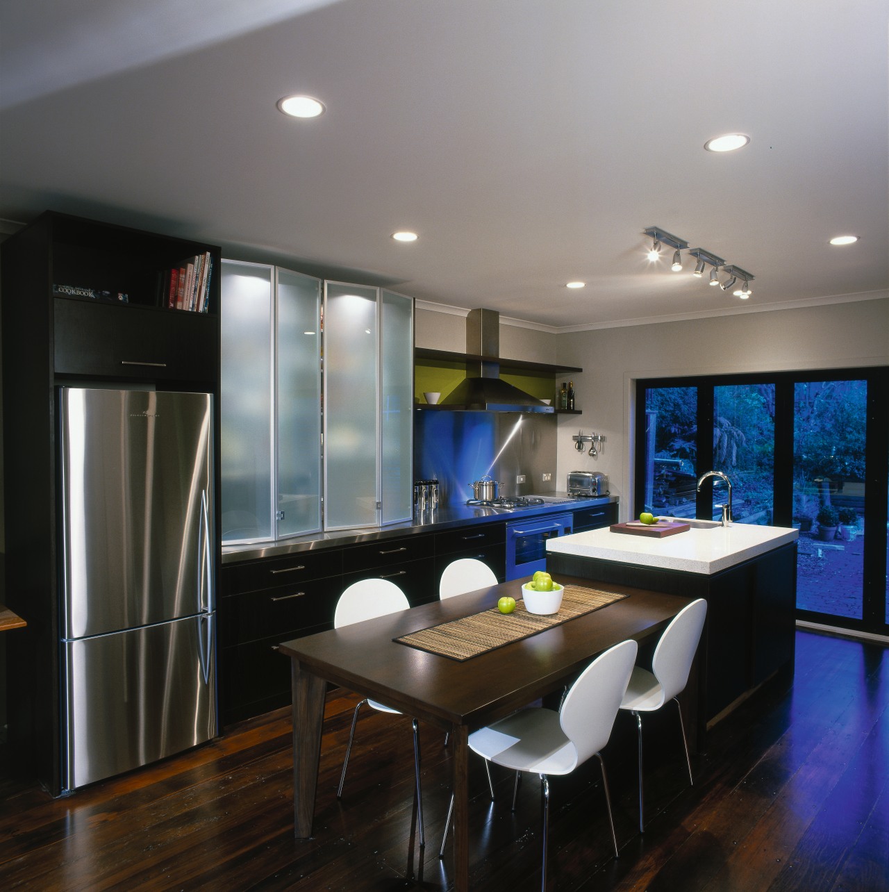 Kitchen with dark cabinetry, stainless steel fridge, rangehood, ceiling, countertop, dining room, interior design, kitchen, real estate, room, gray, black