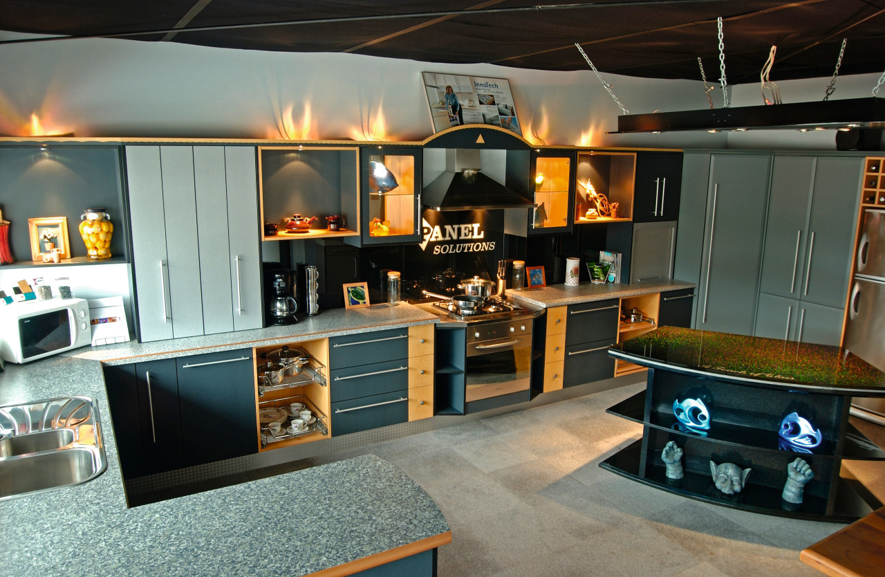 Showroom kitchen with light grey benchtop, dark grey interior design, gray, black