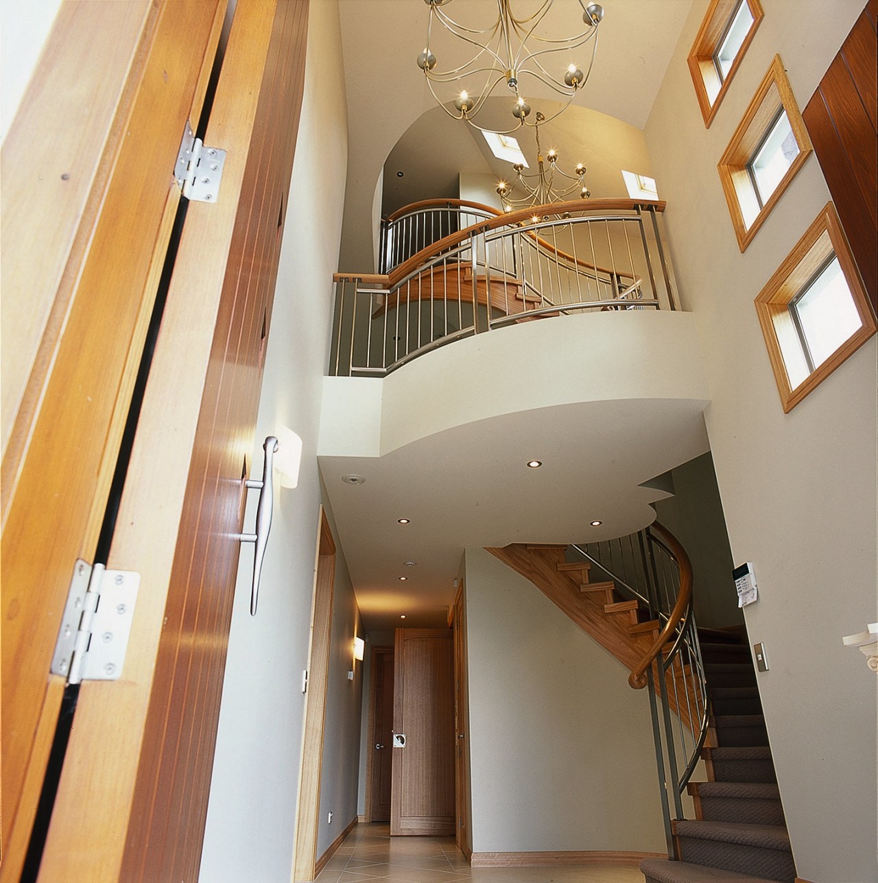 The staircase of this large home architecture, ceiling, daylighting, estate, handrail, home, interior design, lobby, property, real estate, stairs, structure, orange, brown