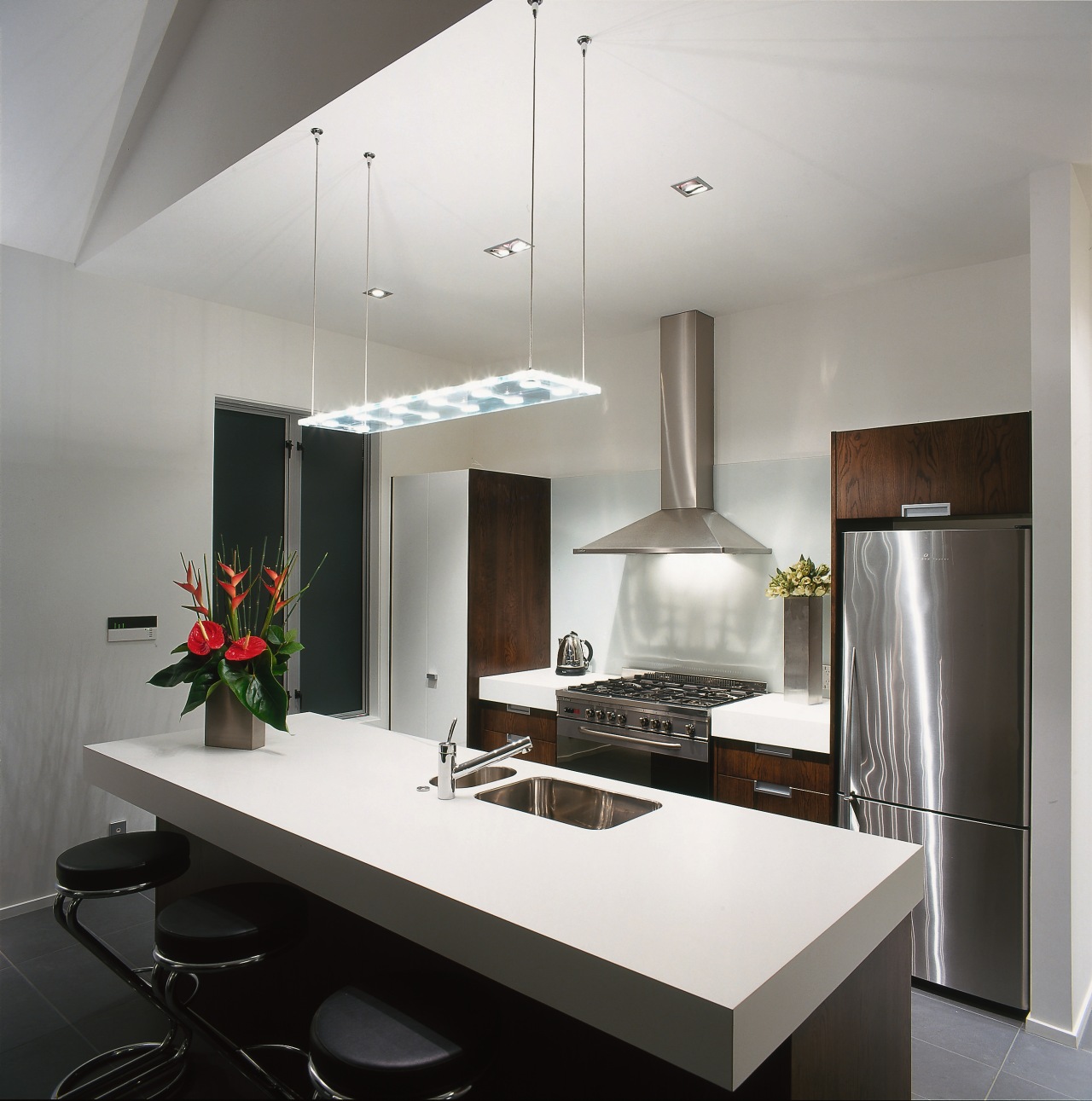 A kitchen featuring an Itailan styled pendant above countertop, interior design, kitchen, product design, gray, white, black