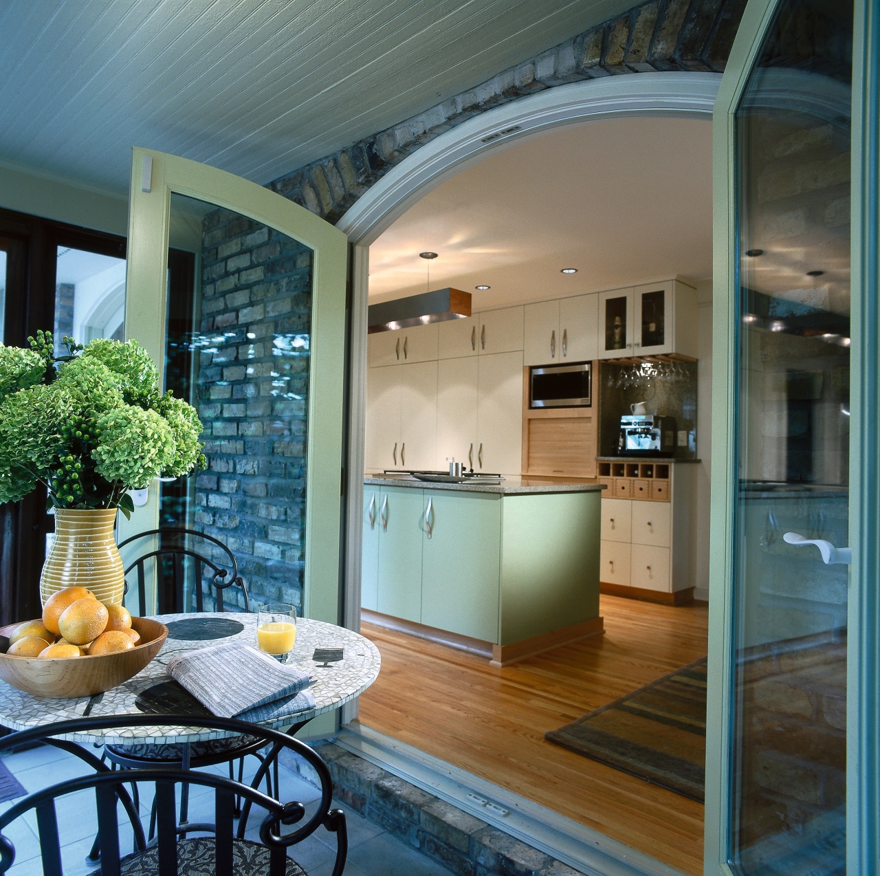 Kitchen leading out onto a covered patio. Outside: ceiling, countertop, home, interior design, kitchen, real estate, window