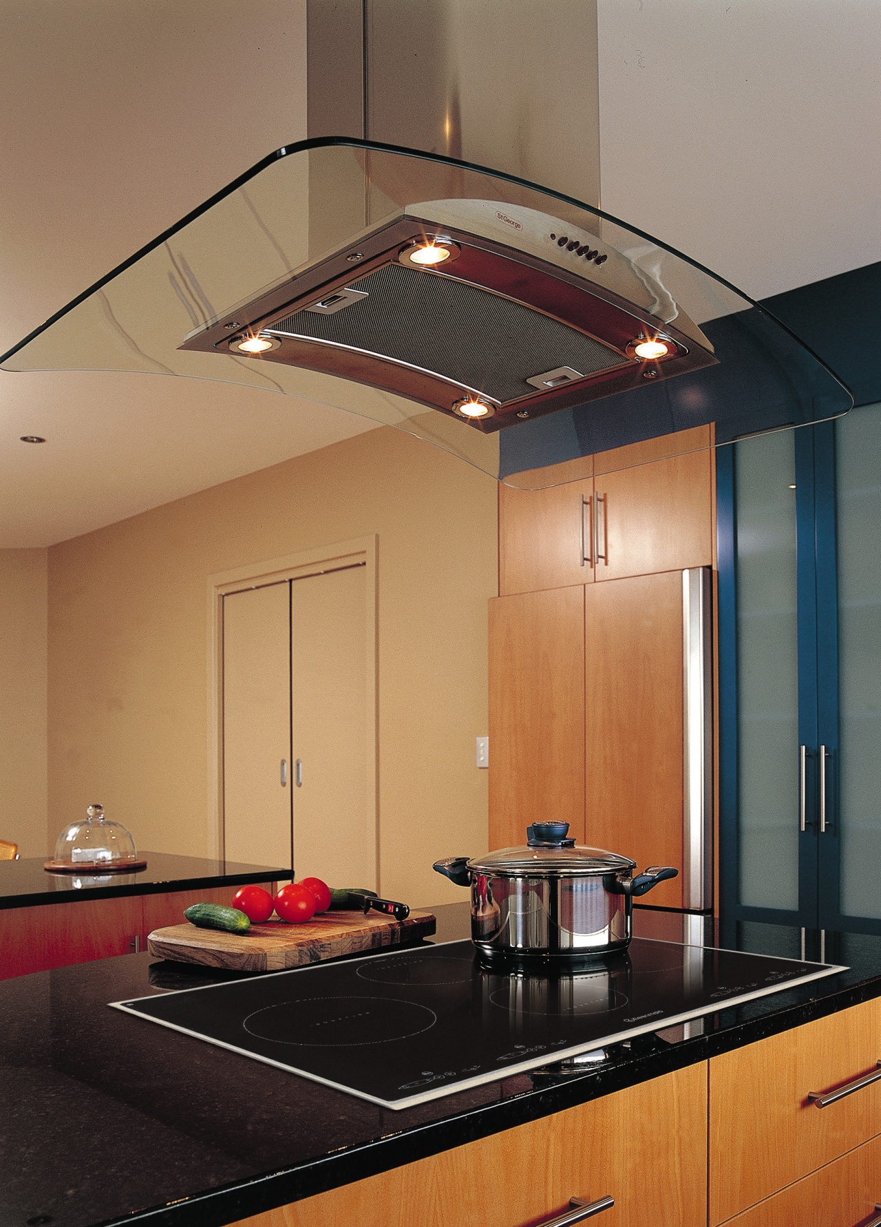 Kitchen with induction cooktop set into black benchtop ceiling, countertop, daylighting, interior design, kitchen, light fixture, lighting, under cabinet lighting, brown, orange