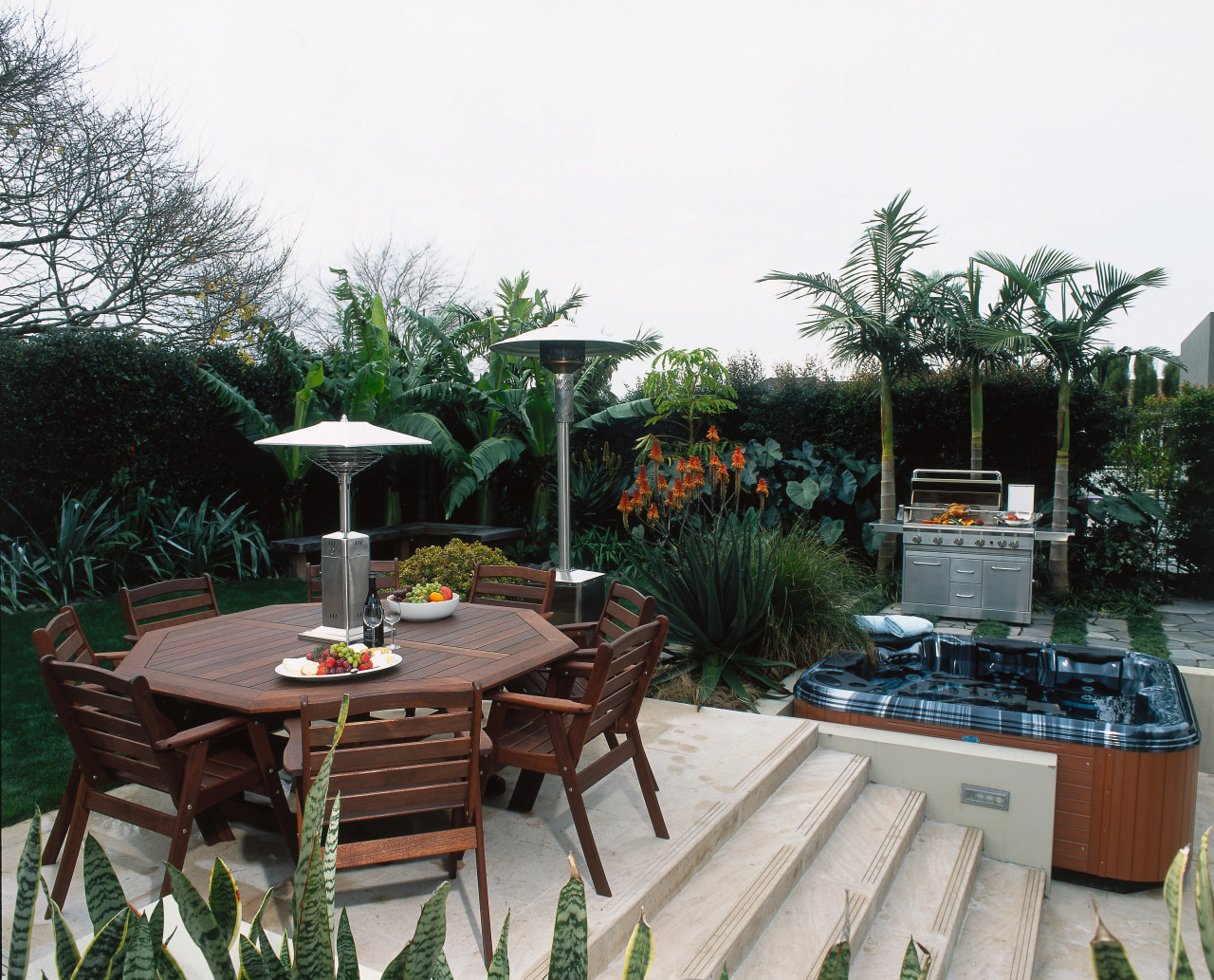 Timber table and chairs with table top heater arecales, backyard, courtyard, garden, outdoor structure, patio, plant, table, tree, yard, white, black