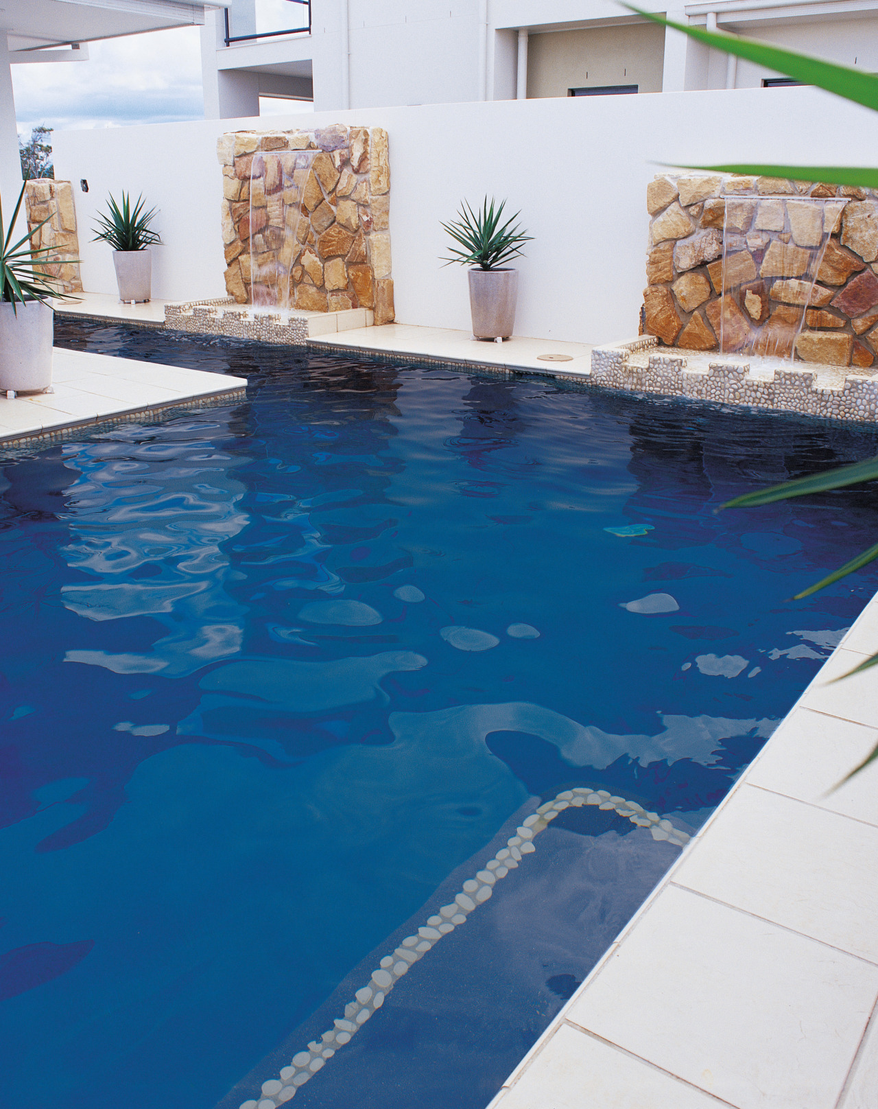 View of blue pool with white surrounding pavers floor, flooring, leisure, property, swimming pool, water, blue, white