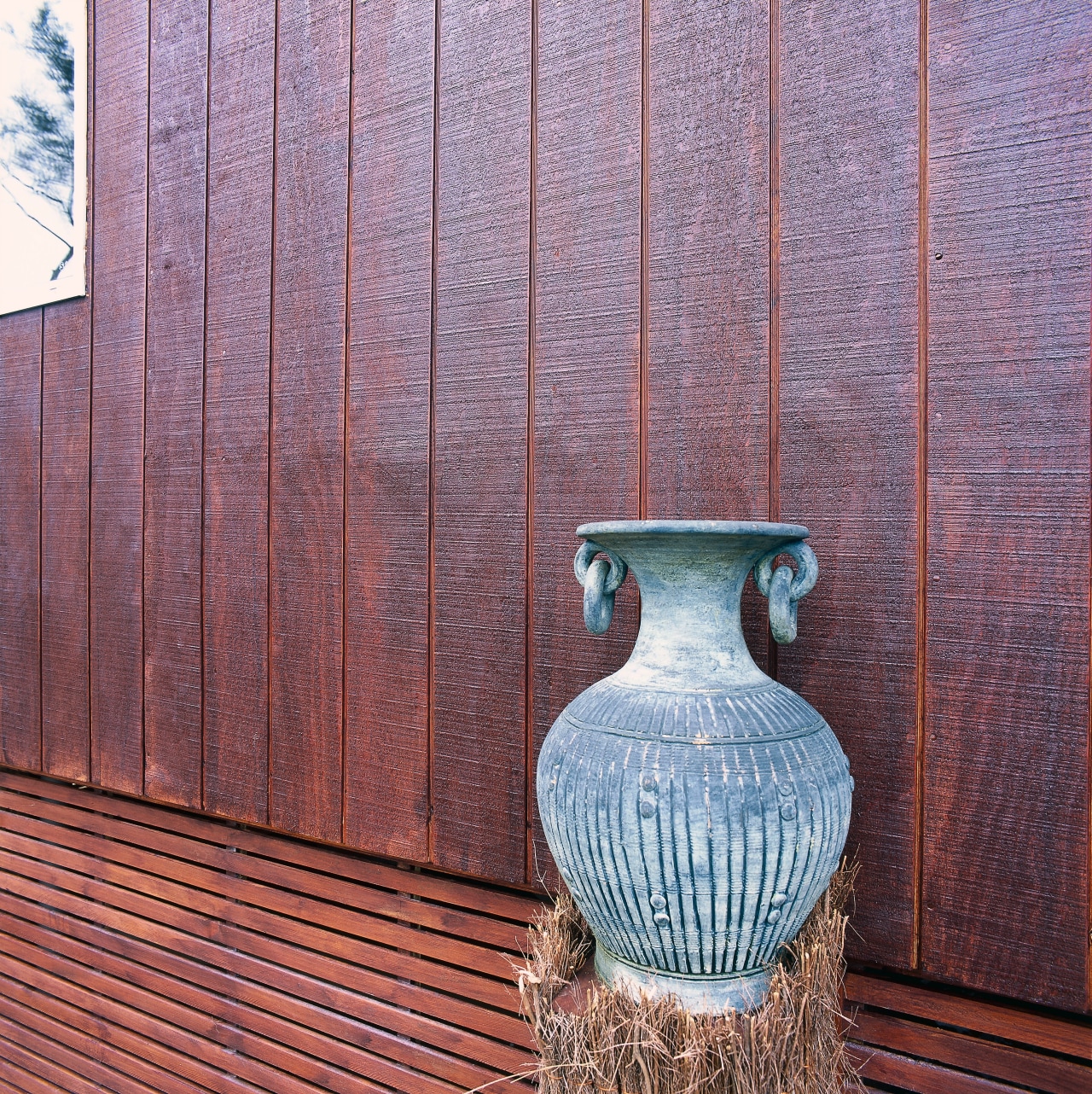 View of the home's cladding wall, wood, wood stain, red, purple