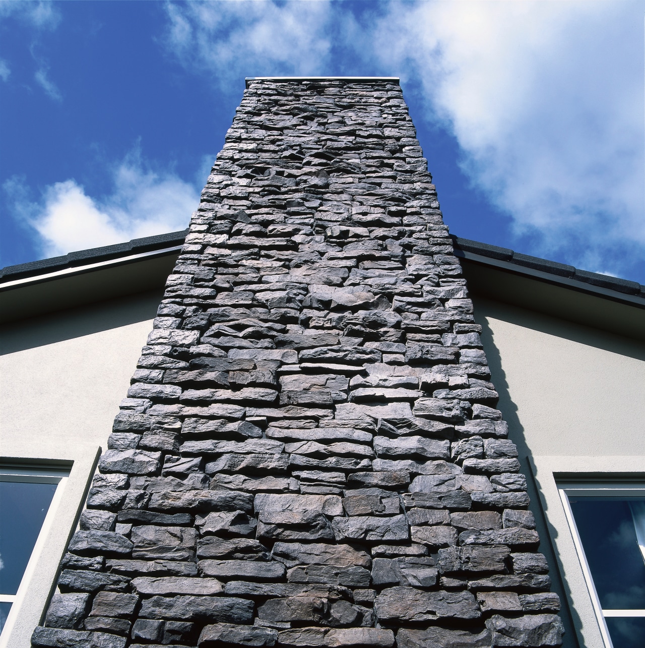 View of the stonework by Stutex Stone building, chimney, roof, sky, wall, white, black, blue