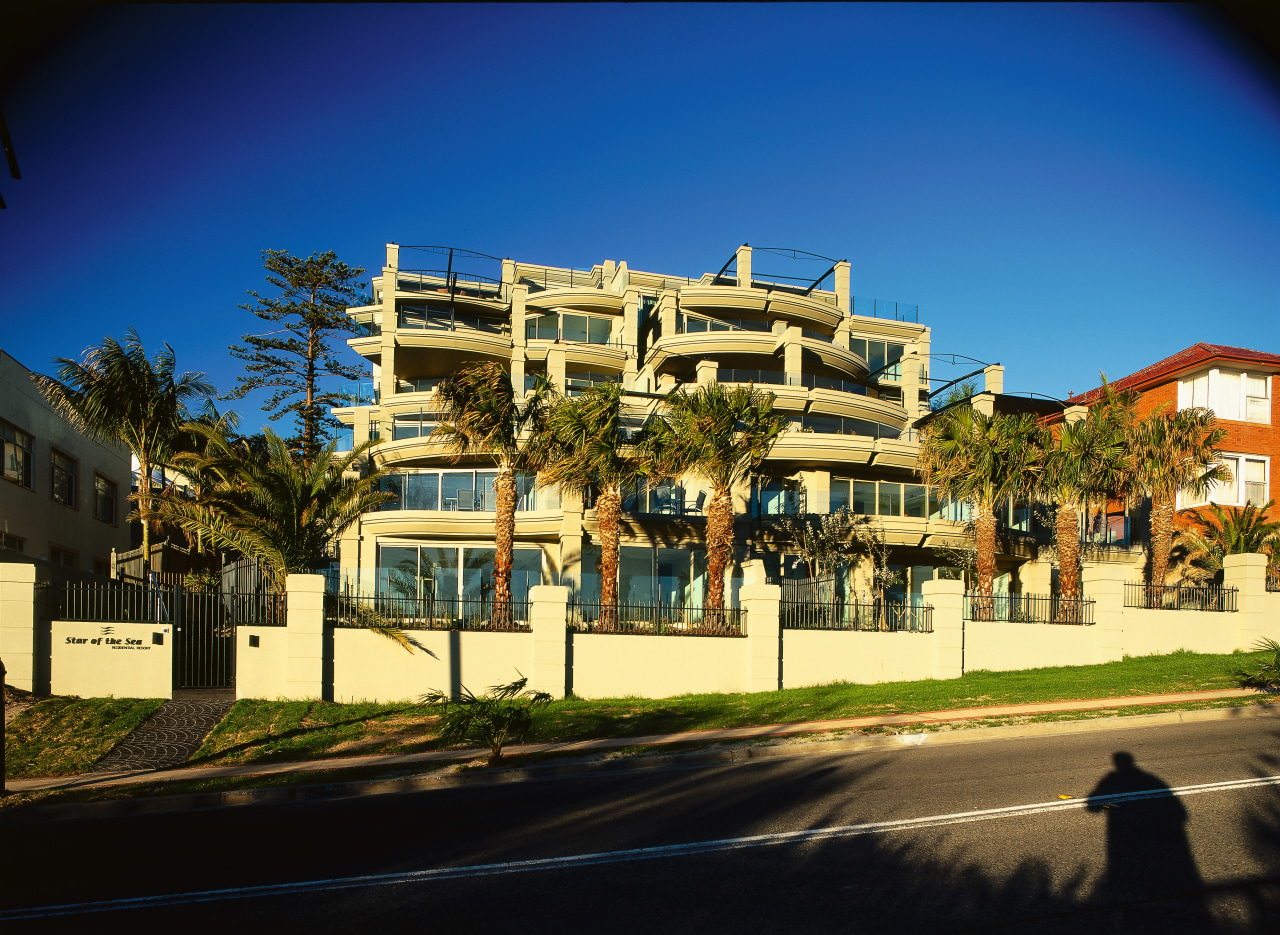 roadside view of apartments apartment, architecture, arecales, building, city, condominium, estate, facade, home, house, metropolitan area, mixed use, neighbourhood, palm tree, property, real estate, residential area, sky, suburb, tree, blue