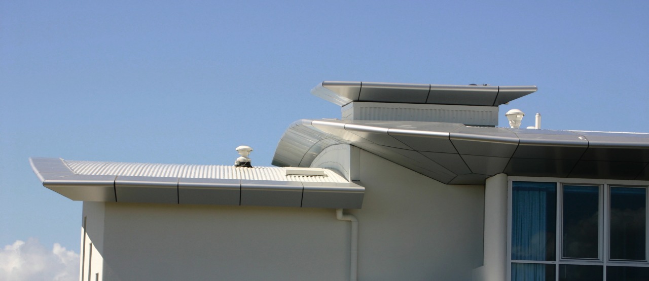 Top section of apartment building showing cladding panels architecture, building, daylighting, facade, house, roof, sky, technology, teal, gray