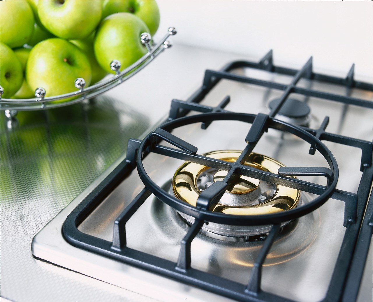 Closeup of gas hob on benchtop. product design, white