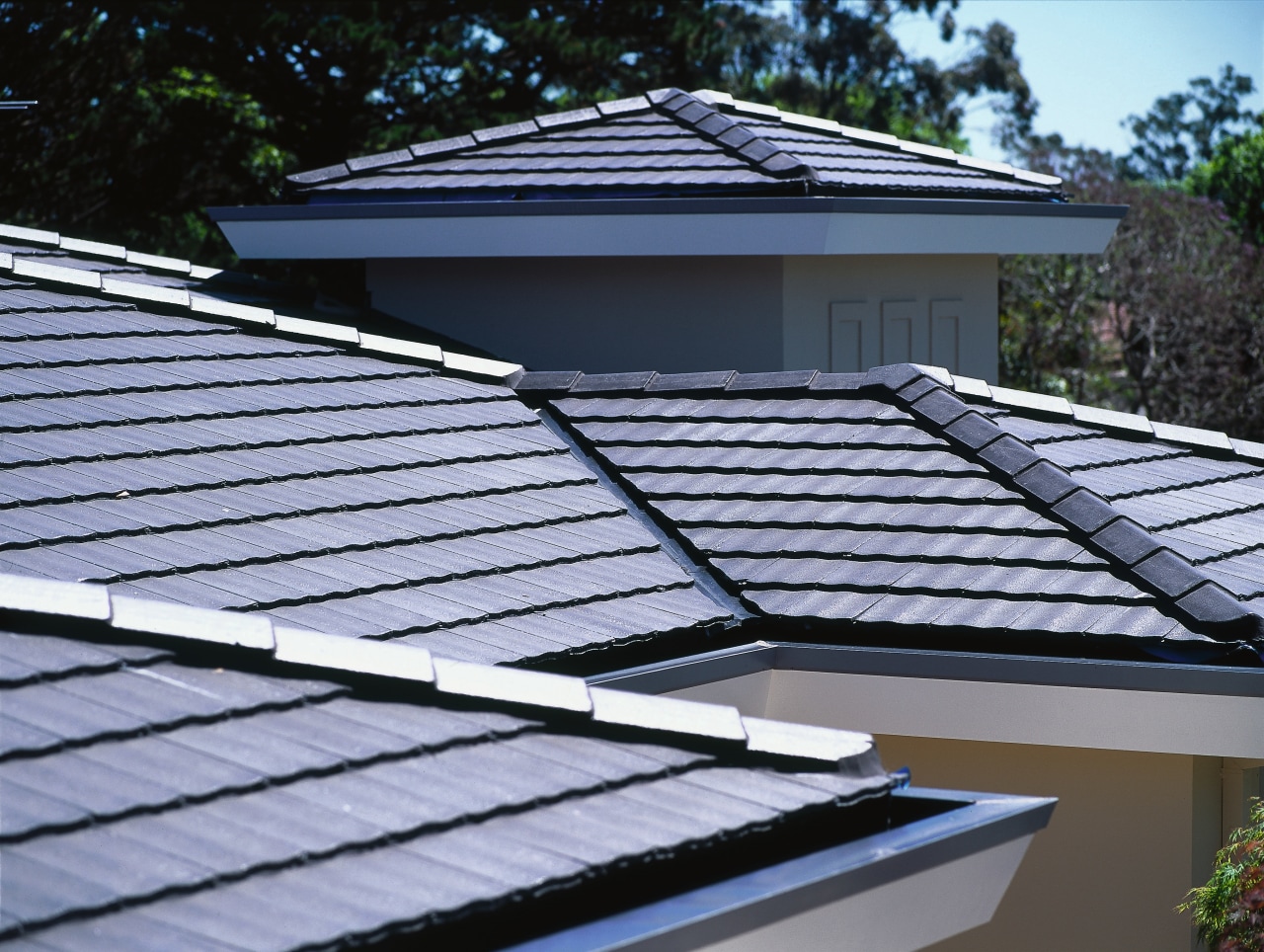 View of grey concrete tiles on roof, with daylighting, line, roof, solar panel, solar power, black, teal