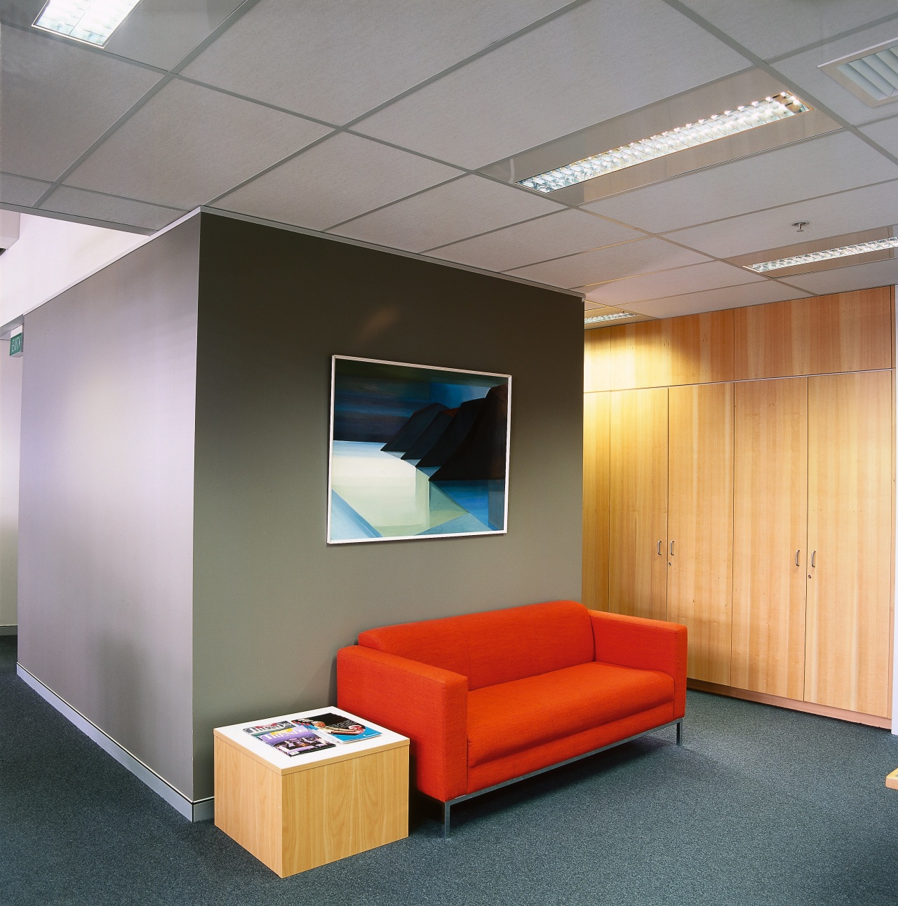 Seating area with red sofa, wood paneling and ceiling, interior design, office, product design, wall, gray