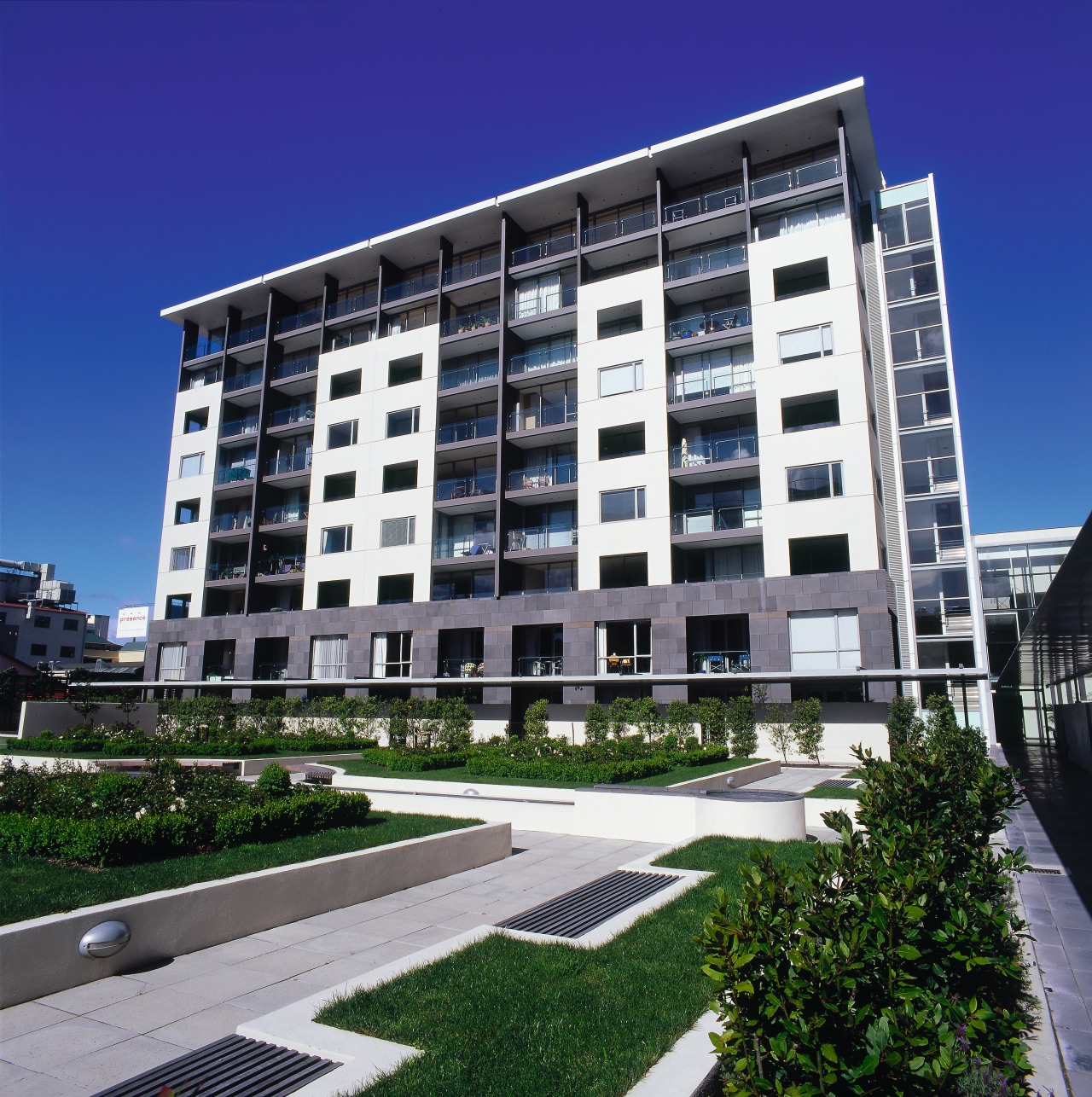 Apartment complex with first two storeys clad in apartment, architecture, building, commercial building, condominium, corporate headquarters, daytime, elevation, facade, headquarters, house, metropolitan area, mixed use, neighbourhood, property, real estate, residential area, tower block, blue