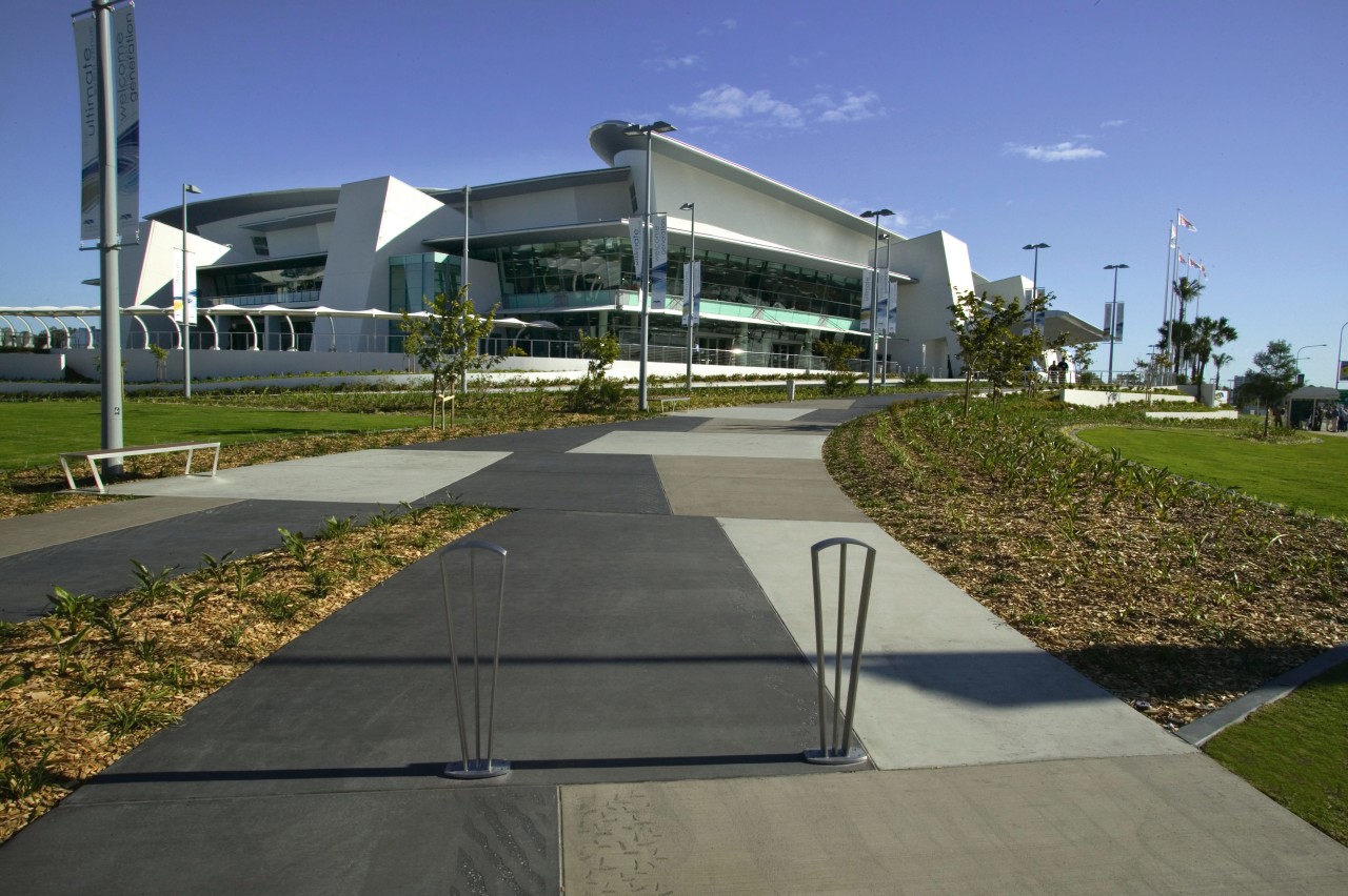 Exterior view of convention complex from concrete walkway, architecture, asphalt, condominium, corporate headquarters, estate, grass, house, real estate, residential area, urban design, walkway, gray