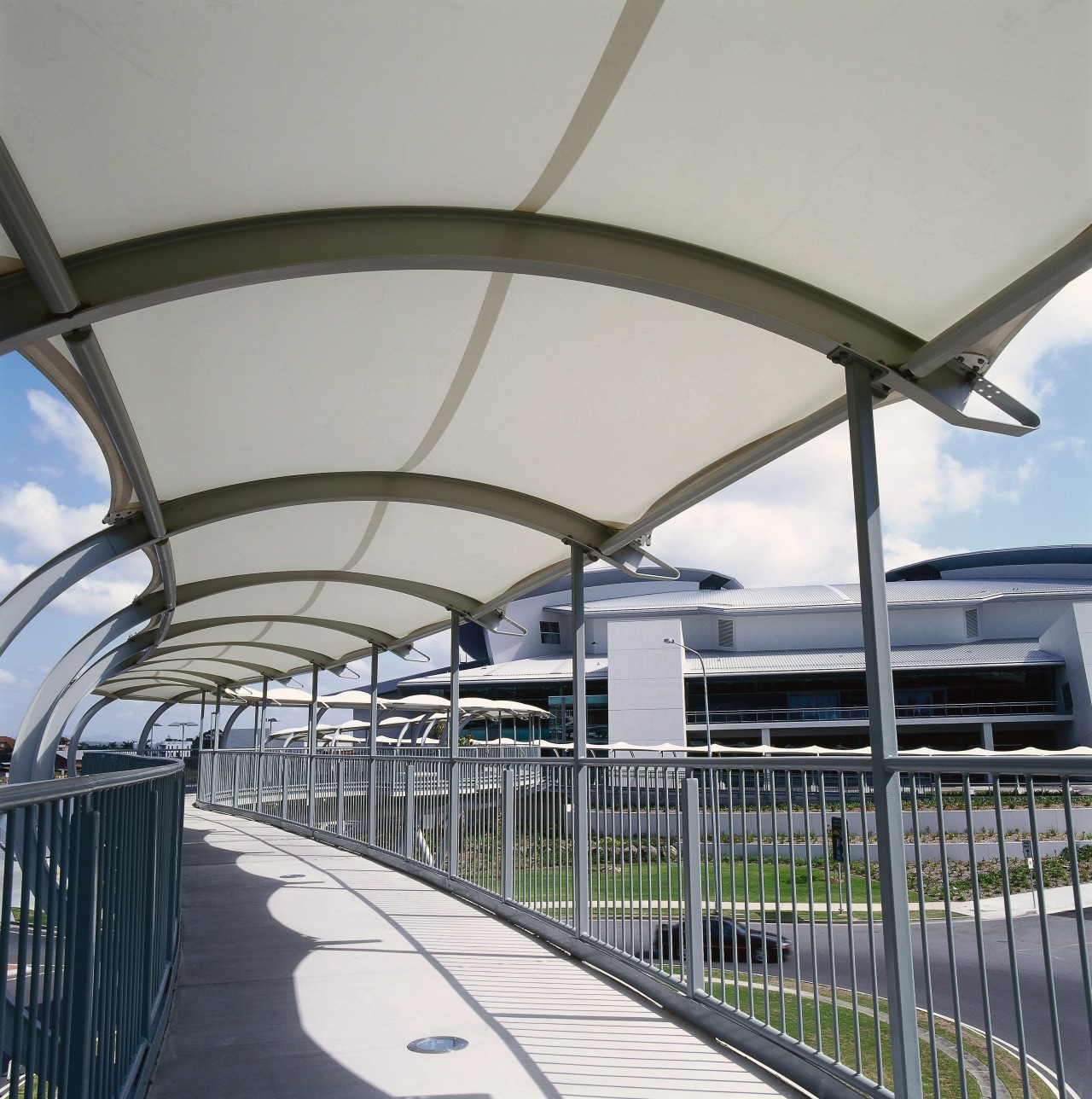 Pedestrian walkway bridge with steel frame with steel architecture, building, daylighting, fixed link, infrastructure, metropolitan area, roof, steel, structure, gray