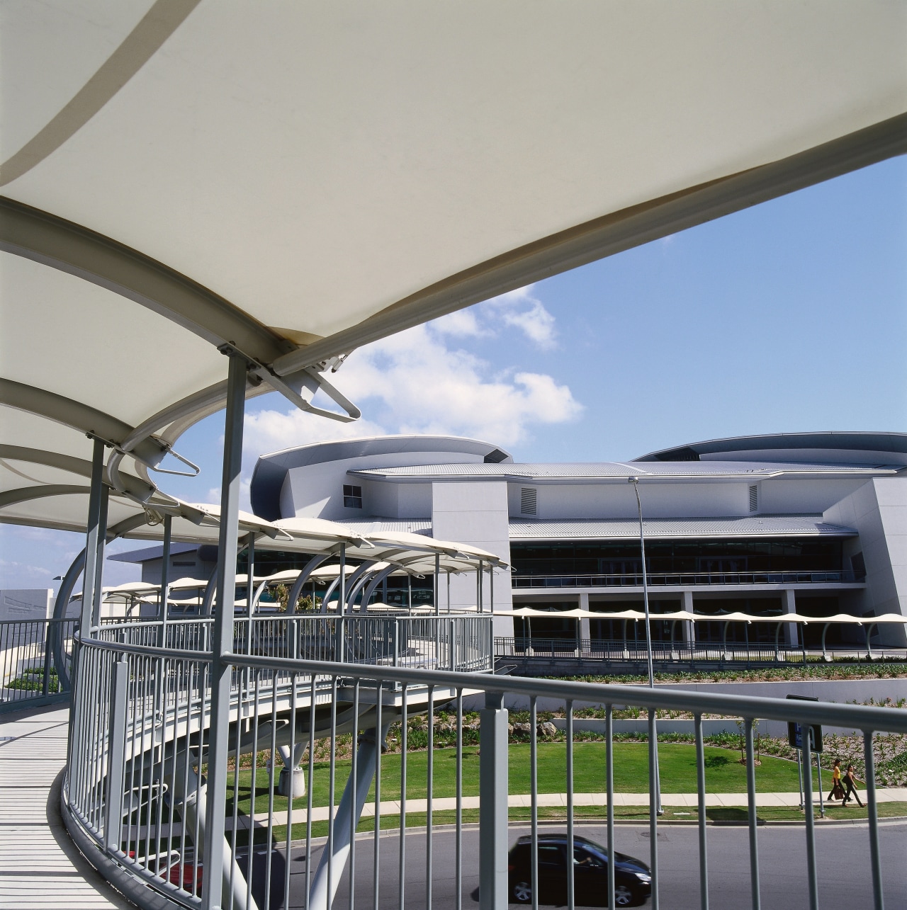 Curved section of pedestrian bridge, showing steel balustrade architecture, building, structure, gray