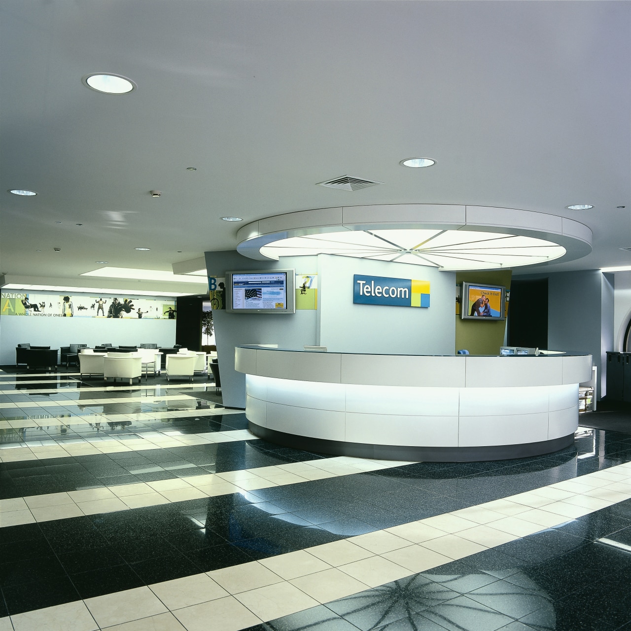 Large white reception desk with flat tv screens infrastructure, product design, gray