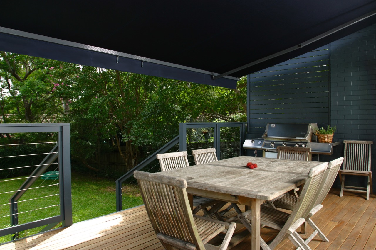 Veranda with outdoor dining furniture, covered by black backyard, deck, house, outdoor structure, patio, property, real estate, black, brown