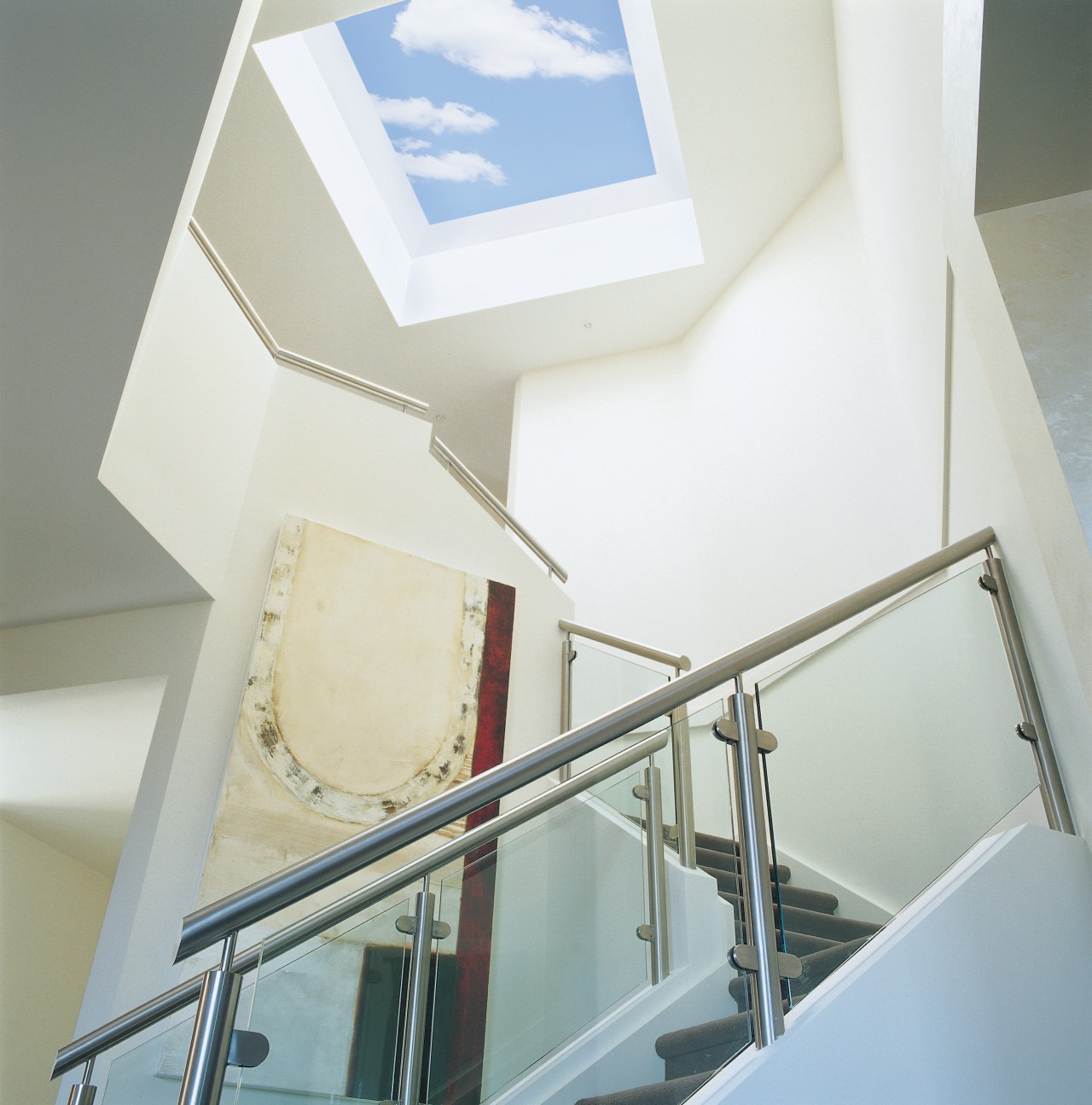 Stairwell with glass and chrome balustrades, white walls, architecture, ceiling, daylighting, glass, handrail, product design, stairs, window, white, gray