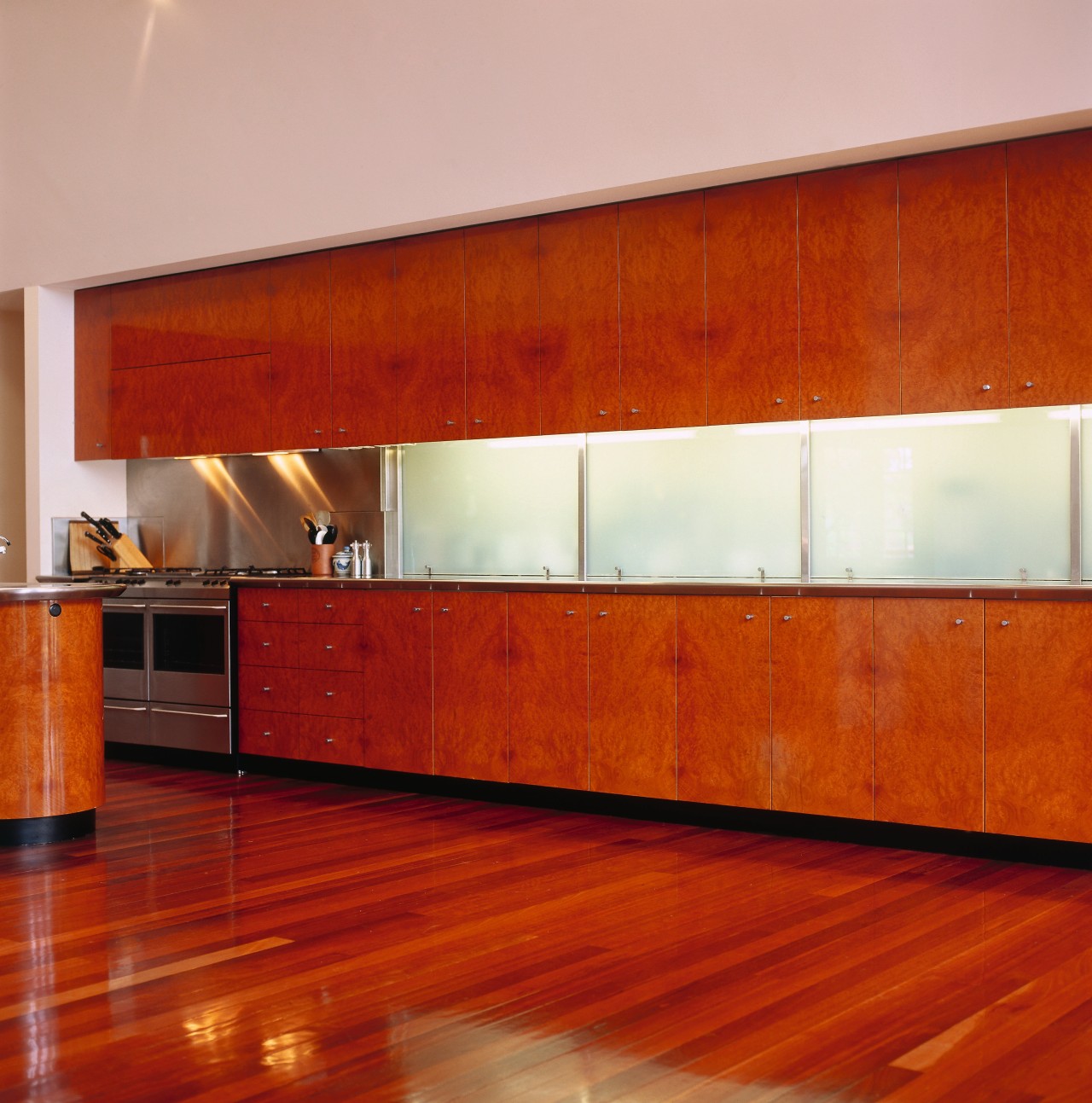 view of the madrona burr veneer cabinetry and architecture, cabinetry, ceiling, countertop, floor, flooring, furniture, hardwood, house, interior design, laminate flooring, lighting, orange, room, wall, window, wood, wood flooring, wood stain, red