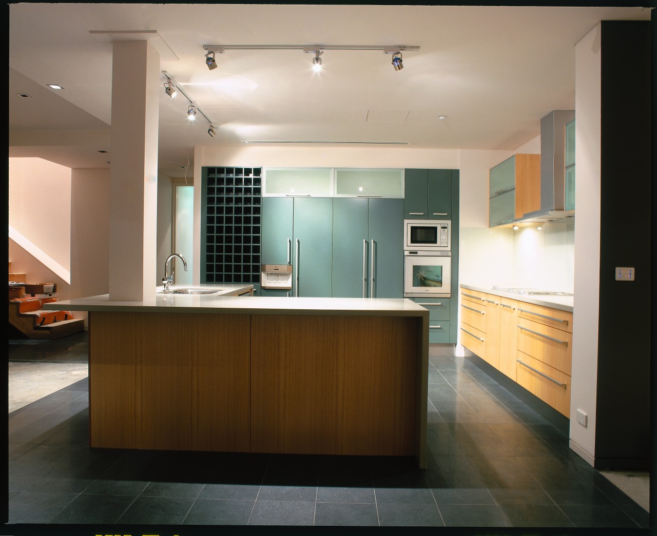 view of a polished stone benchtop architecture, cabinetry, ceiling, countertop, floor, flooring, interior design, kitchen, real estate, room, gray, black