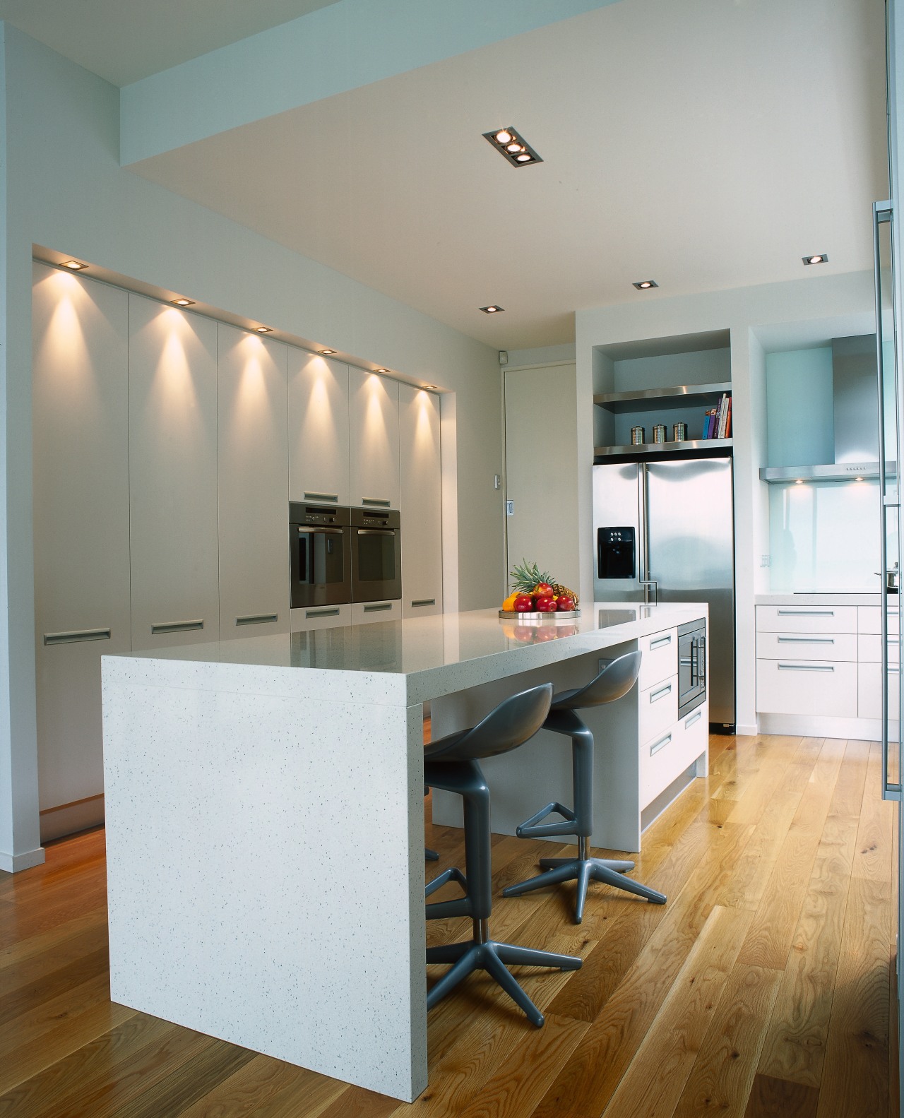 Kitchen with light coloured cabinetry, recessed lights along cabinetry, ceiling, countertop, cuisine classique, floor, flooring, hardwood, interior design, kitchen, laminate flooring, real estate, room, wood flooring, gray