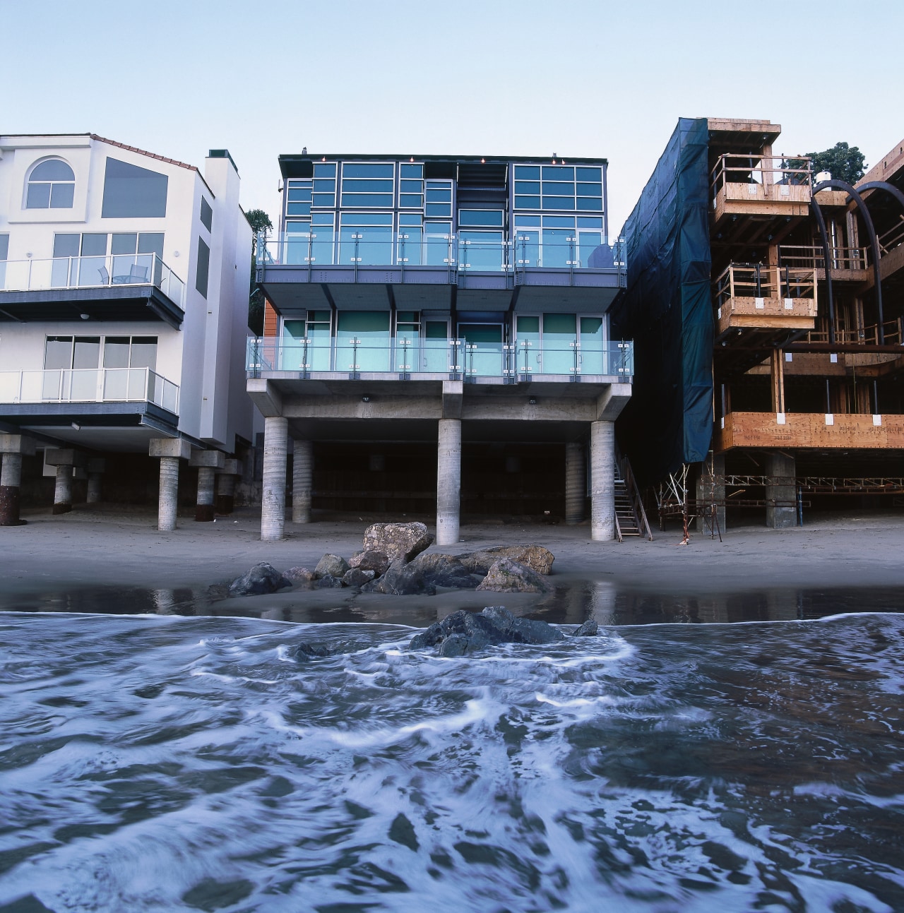 Exterior view of the back of the sqaure architecture, building, condominium, real estate, reflection, water, black